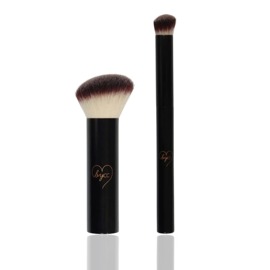 Two makeup brushes with black handles and brown bristles on a white background
